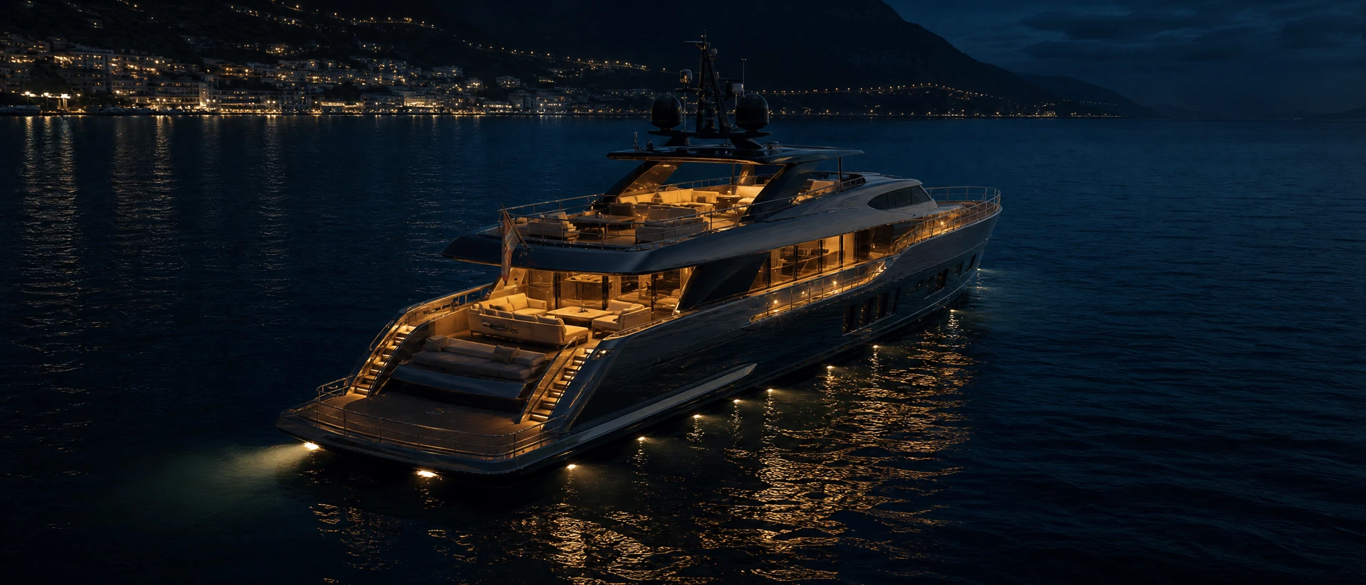 Luxury motor yacht at anchor at twilight